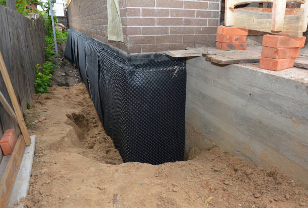 Happy homeowners after waterproofing job in Shawano